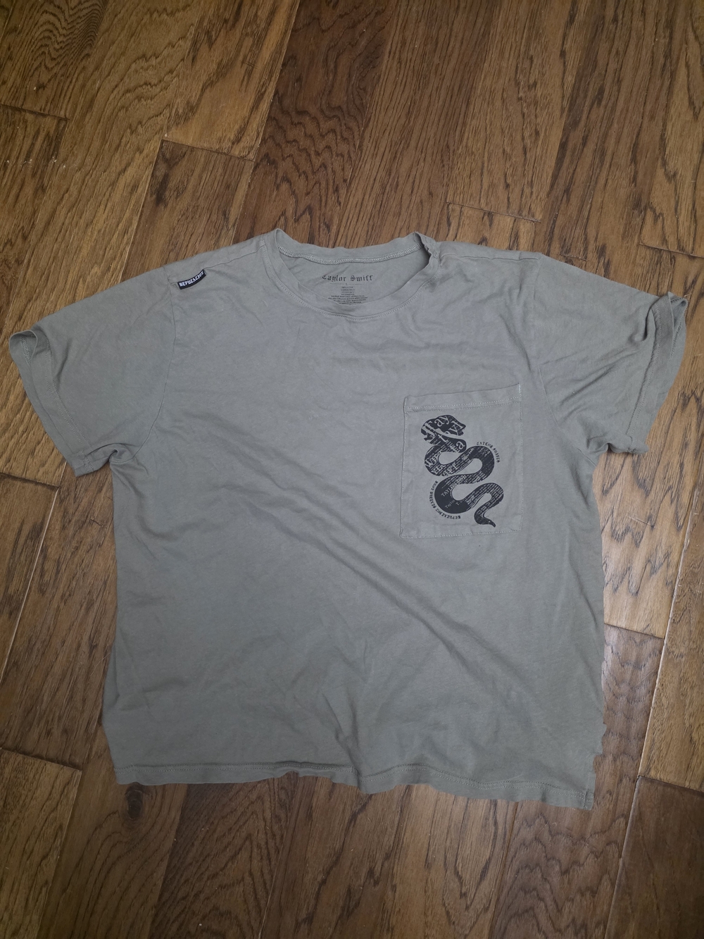 Taylor Swift Reputation Olive Green Short Sleeve Pocket Tee with Snake Print